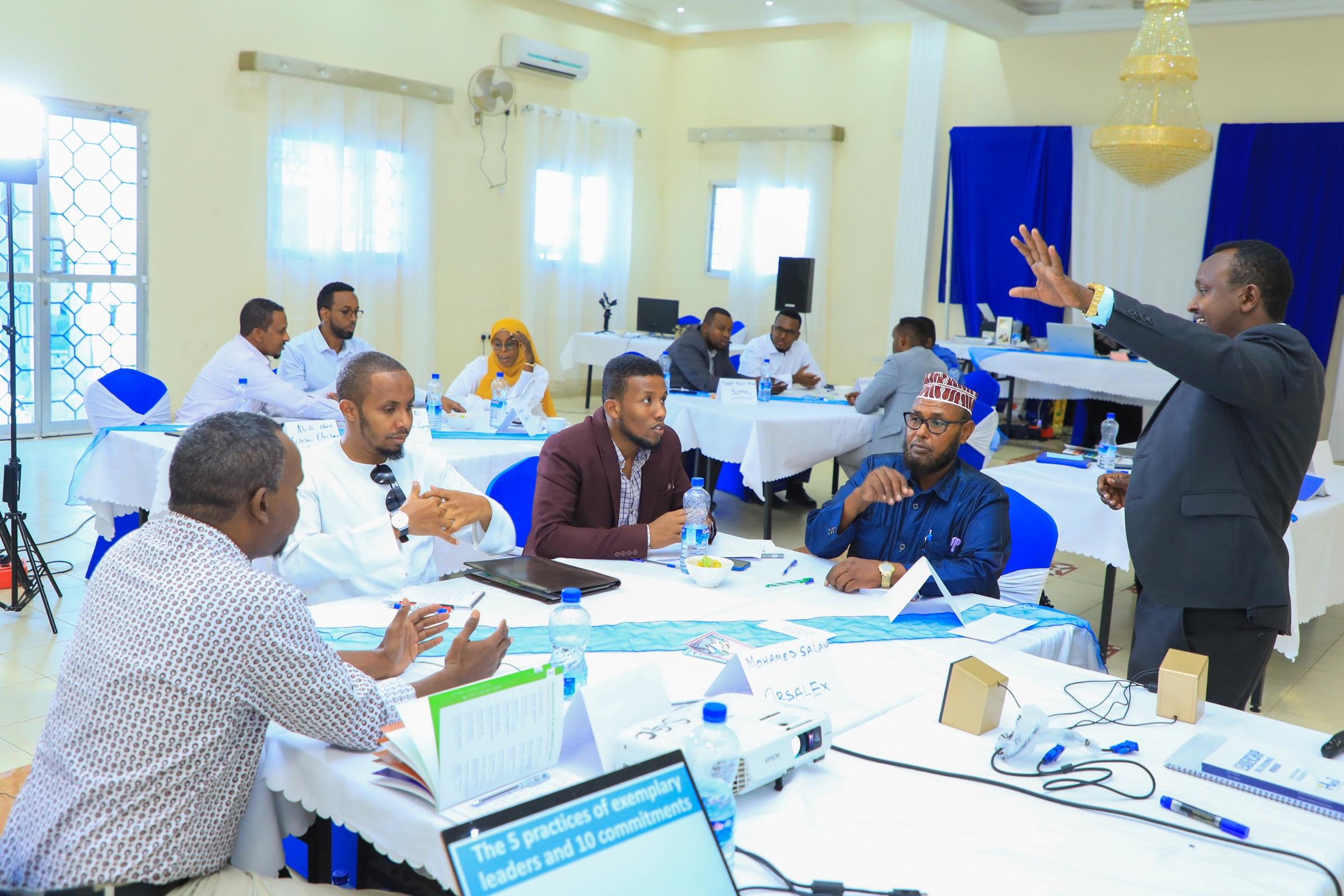 A HASI facilitator working through material with a client team